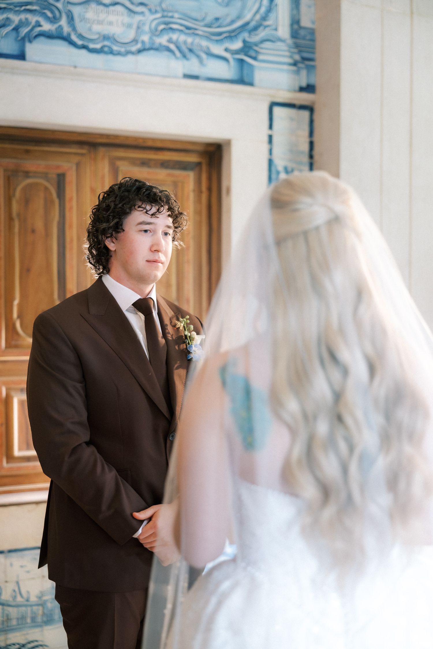 Bride and groom exchanging vows inside Quinta do Torneiro chapel