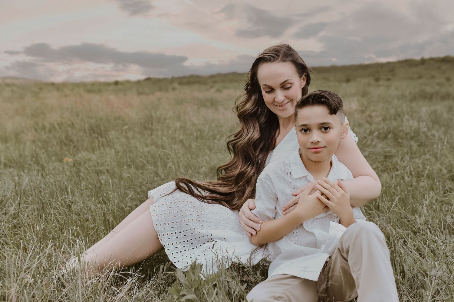 Sisters sharing a hug during multi-generational family photos