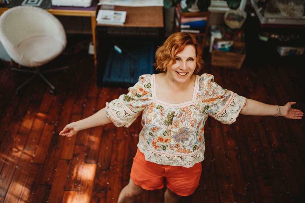A series of candid lifestyle photos showing someone in a floral top and orange shorts moving through a warm-lit room.