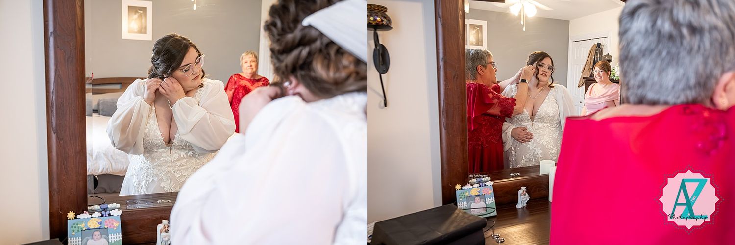A person in a white dress looks in a mirror while getting ready with others in a room.