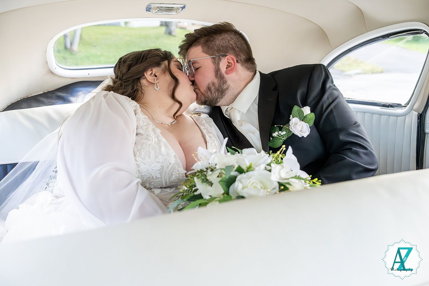 Romantic moments shared between newlyweds in the backseat of a classic vintage car.
