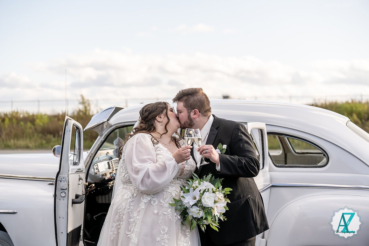 A series of romantic wedding moments captured near a vintage white car on a cloudy day.
