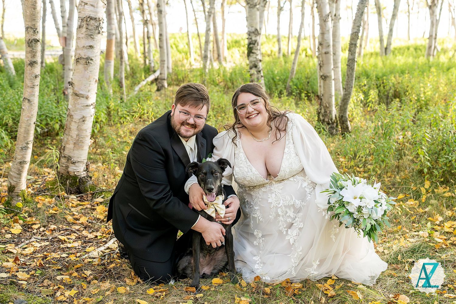 Wedding party poses in a scenic birch tree forest with autumn foliage and natural lighting.