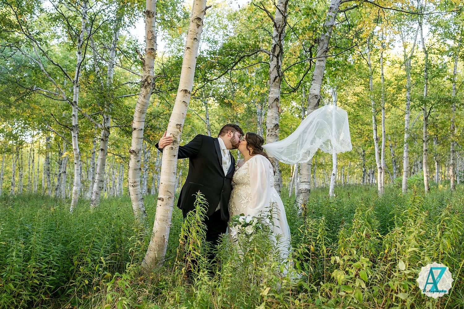 Wedding portrait series in a serene birch forest with soft natural lighting.
