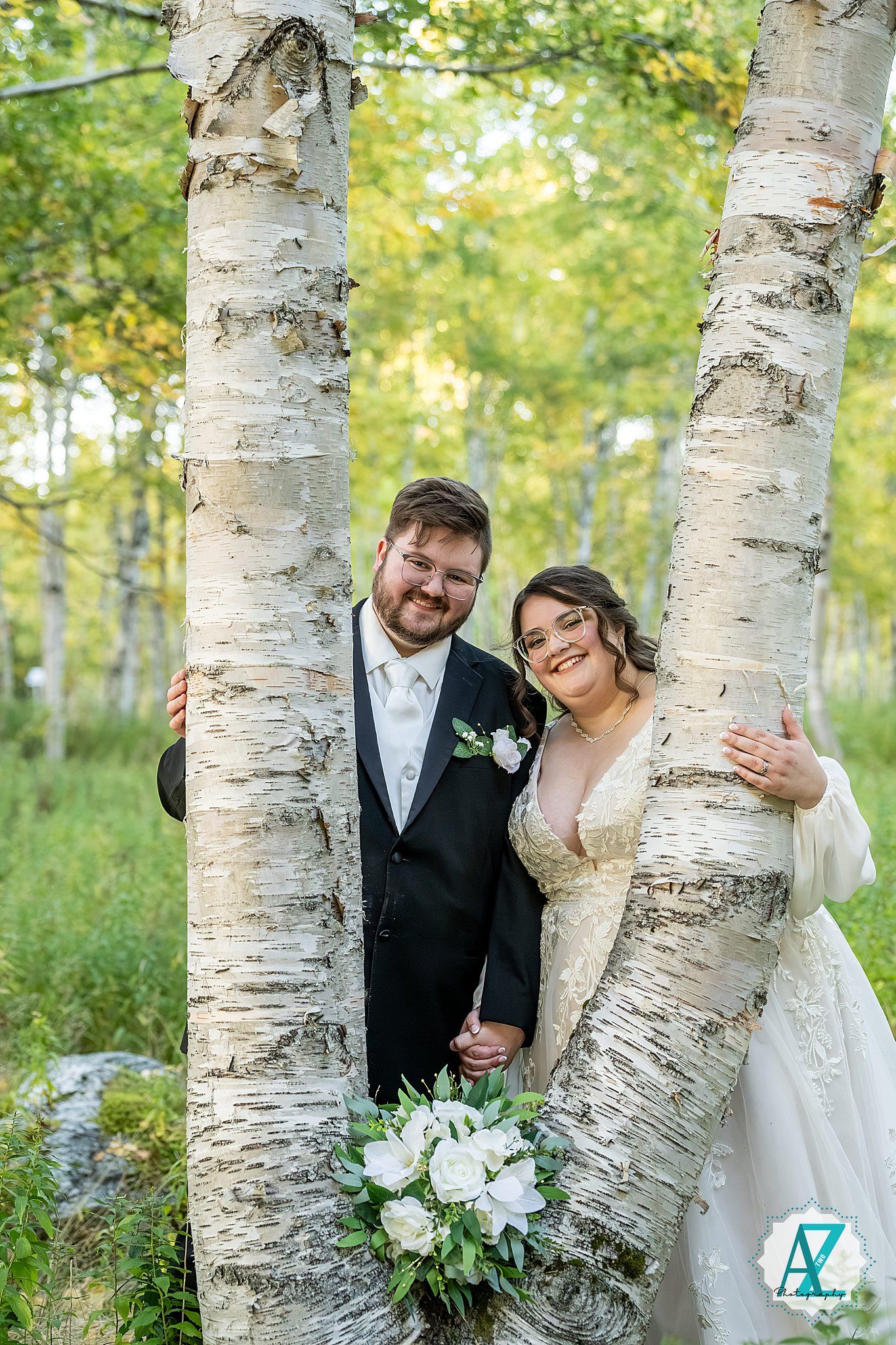 Joyful wedding portraits taken in a beautiful aspen grove with natural lighting.