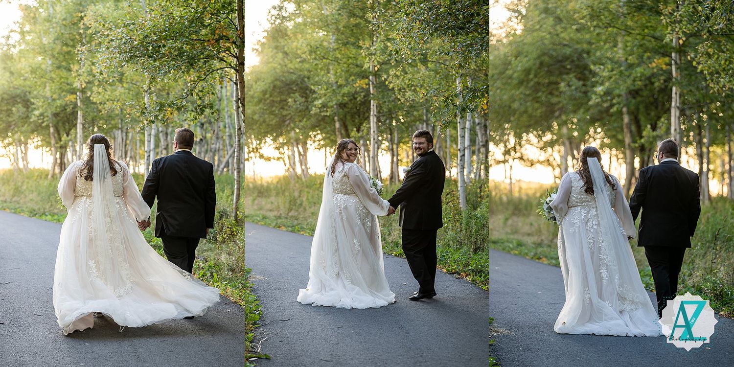 Wedding party strolls through a beautiful grove of birch trees on a sunny afternoon.