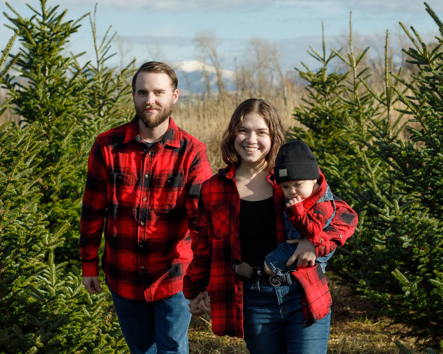 Family Christmas photos at tree farm in Missoula MT