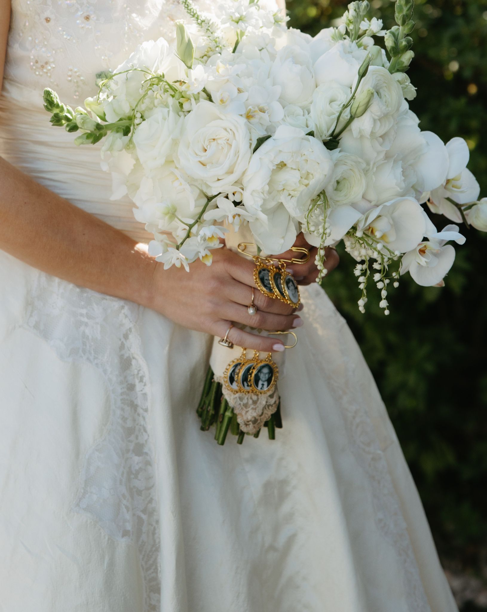 Vintage soft white bouquet with roses and heirloom photos, complementing the bride in her mother’s wedding dress for a timeless look – Photo