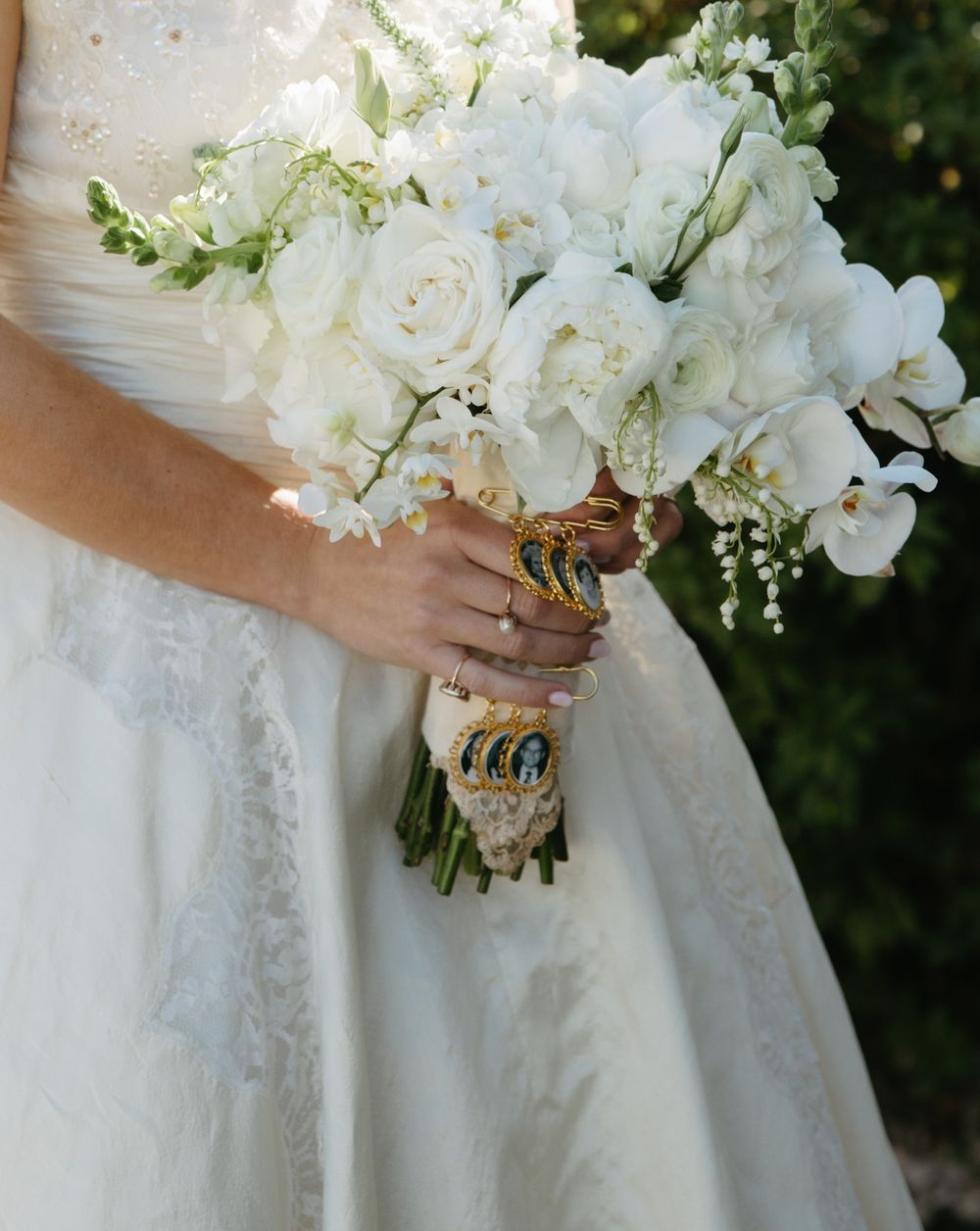 Vintage soft white bouquet with roses and heirloom photos, complementing the bride in her mother’s wedding dress for a timeless look – Photo
