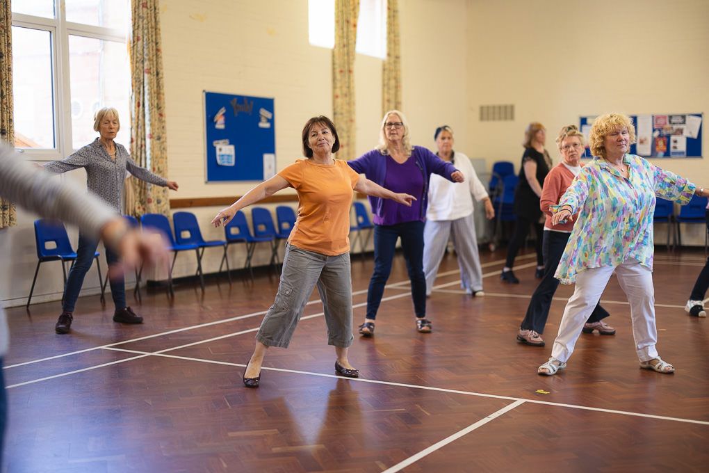 A group of seniors participating in a dance school class in Hitchin, Hertfordshire.