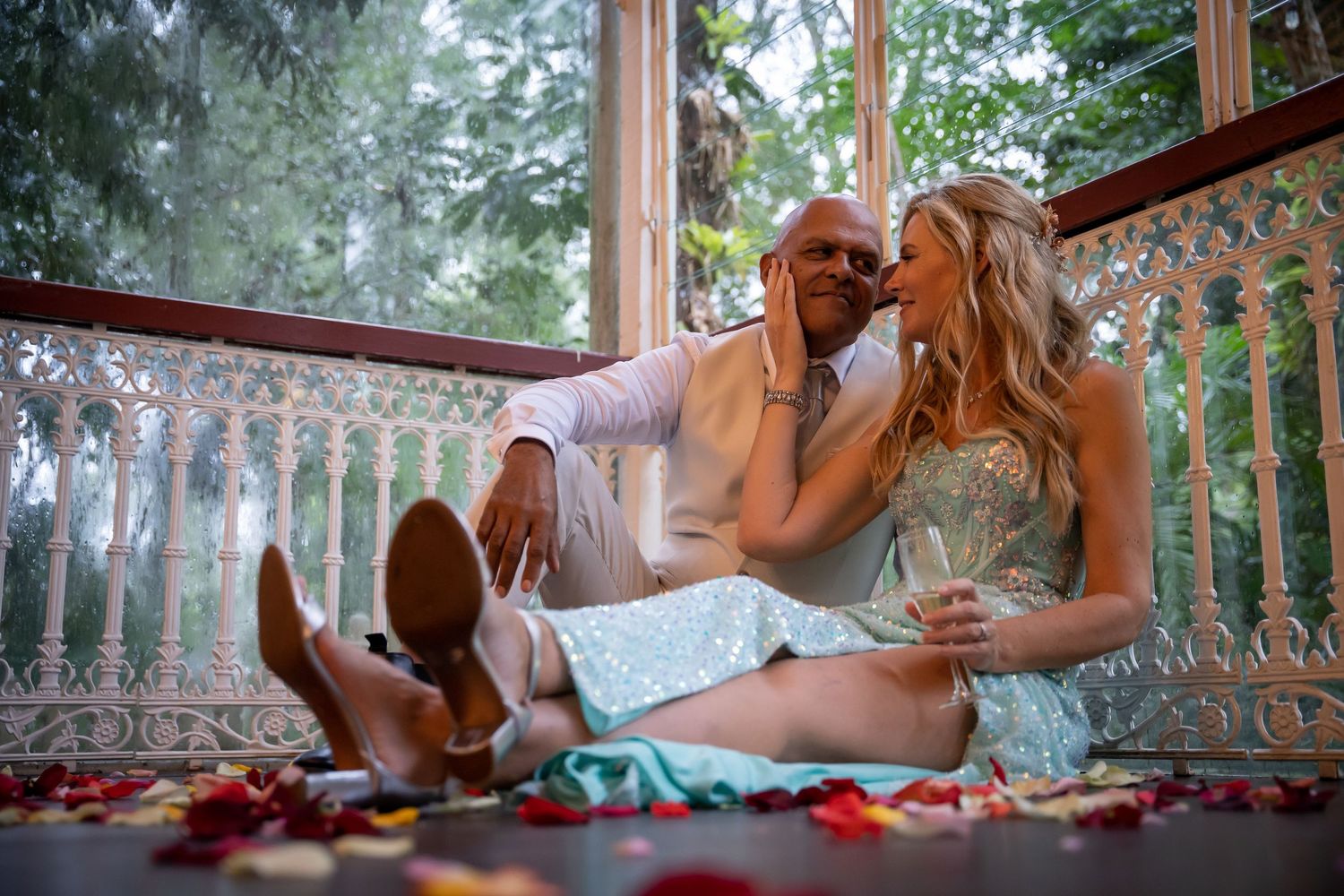 Relaxing on a porch swing with a cozy blanket and throw pillows in a peaceful outdoor setting.