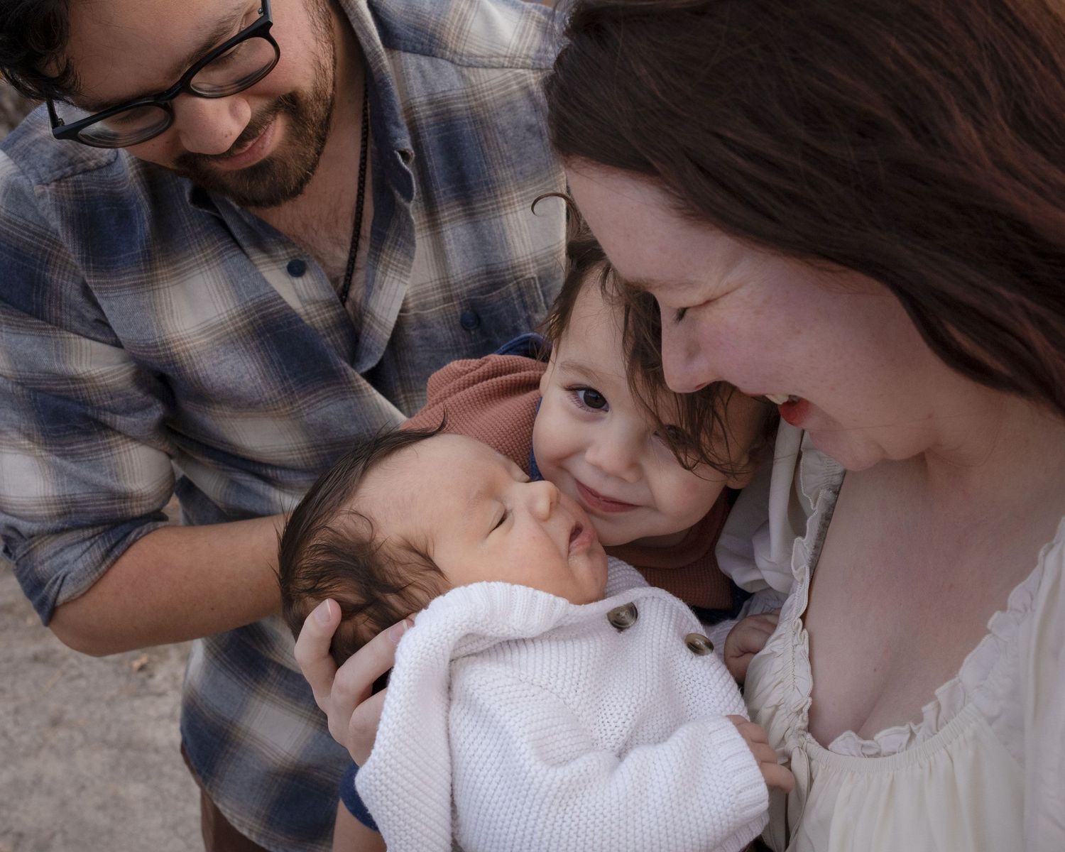 A series of tender family moments showing parents bonding with their baby in matching denim outfits.