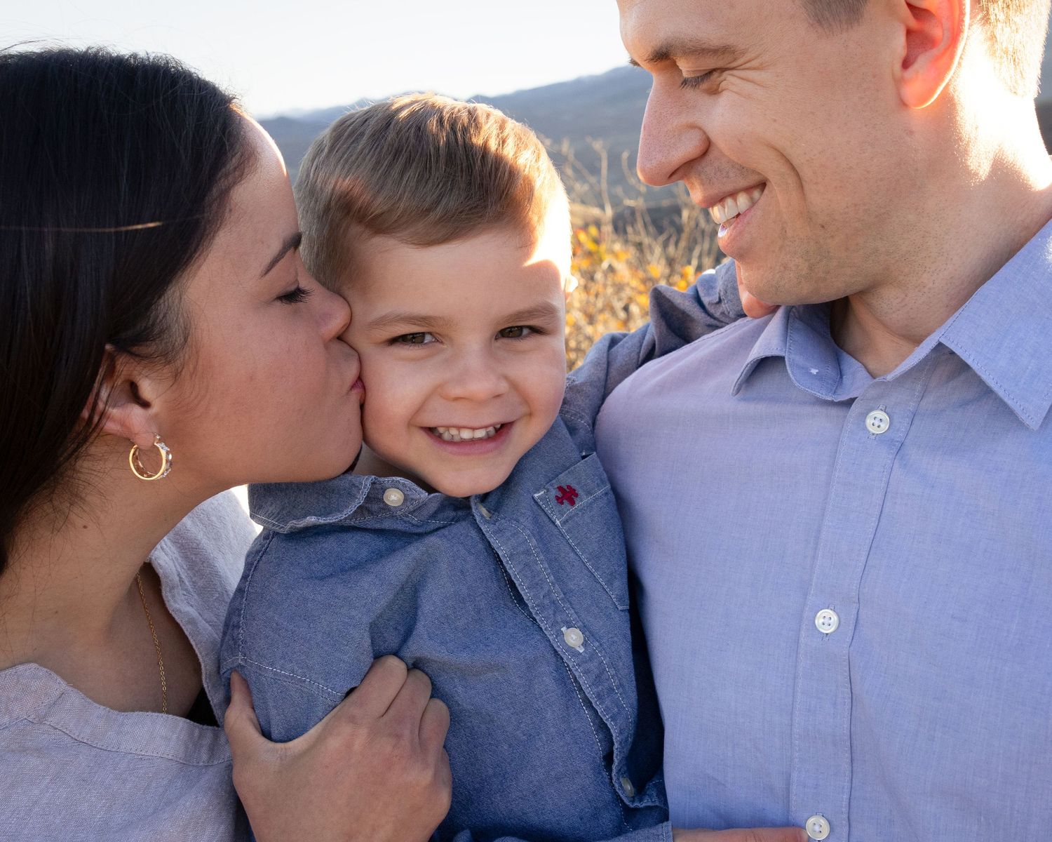 A series of candid family moments showing affection and laughter against a bright outdoor background.