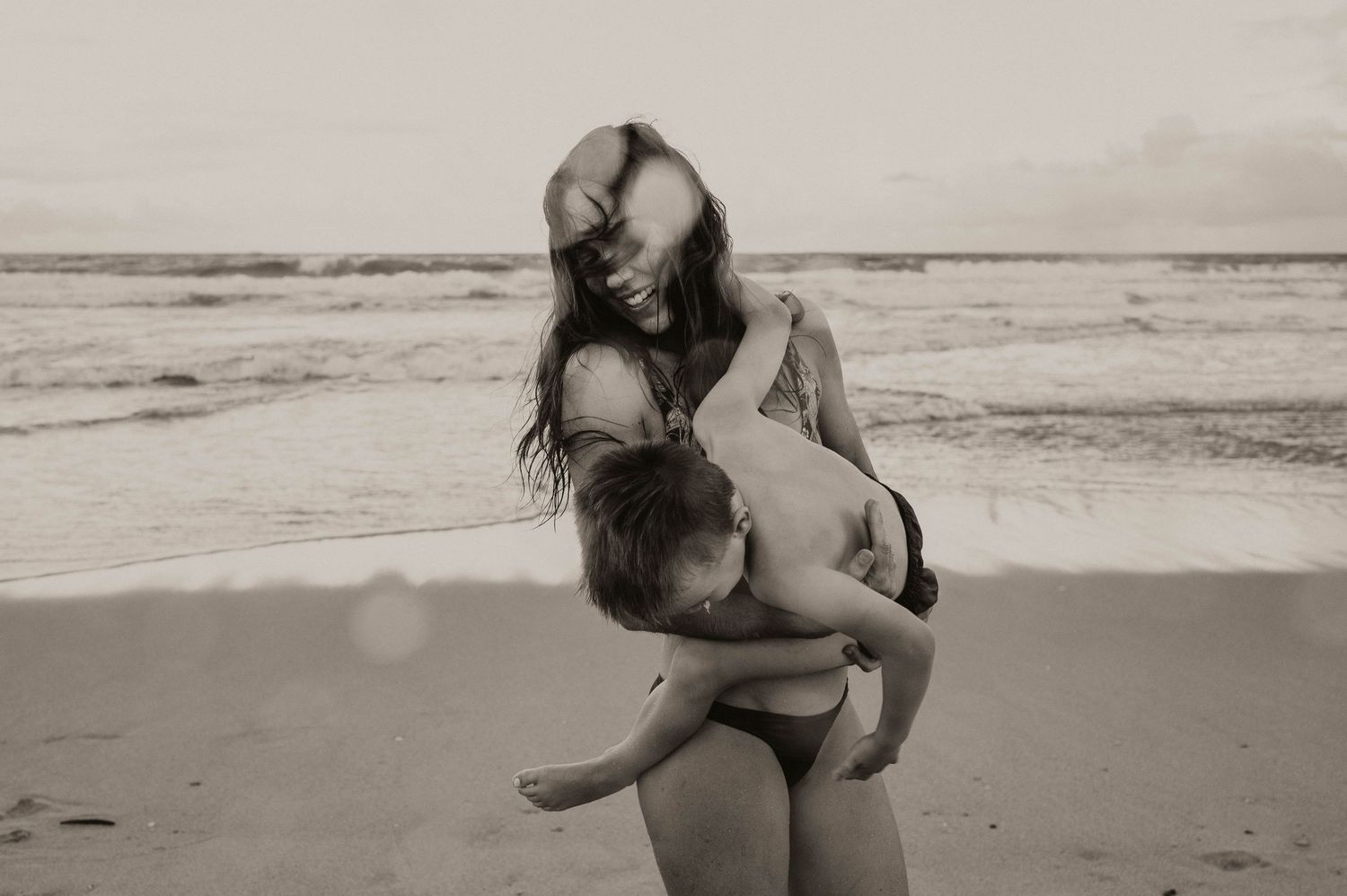 Underwater and Beach Maternity and Family Photographer pregnancy announcement and newborn photoshoot