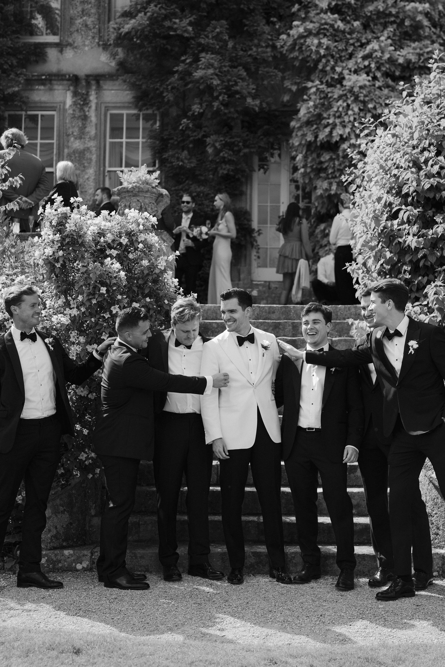 groom and groomsmen laughing and joking at hamswell house wedding in bath