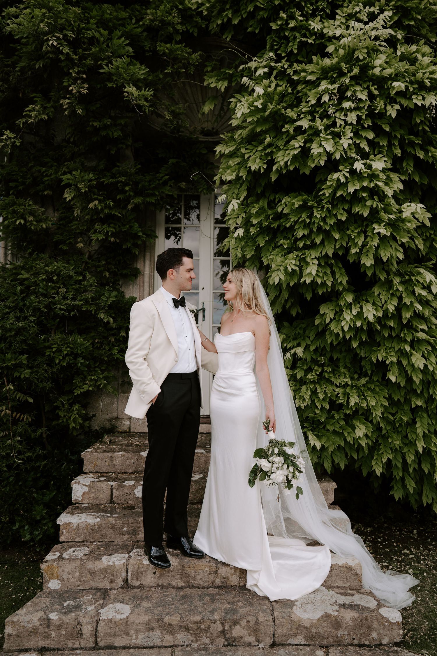 bride and groom smiling at each other at hamswell house in bath