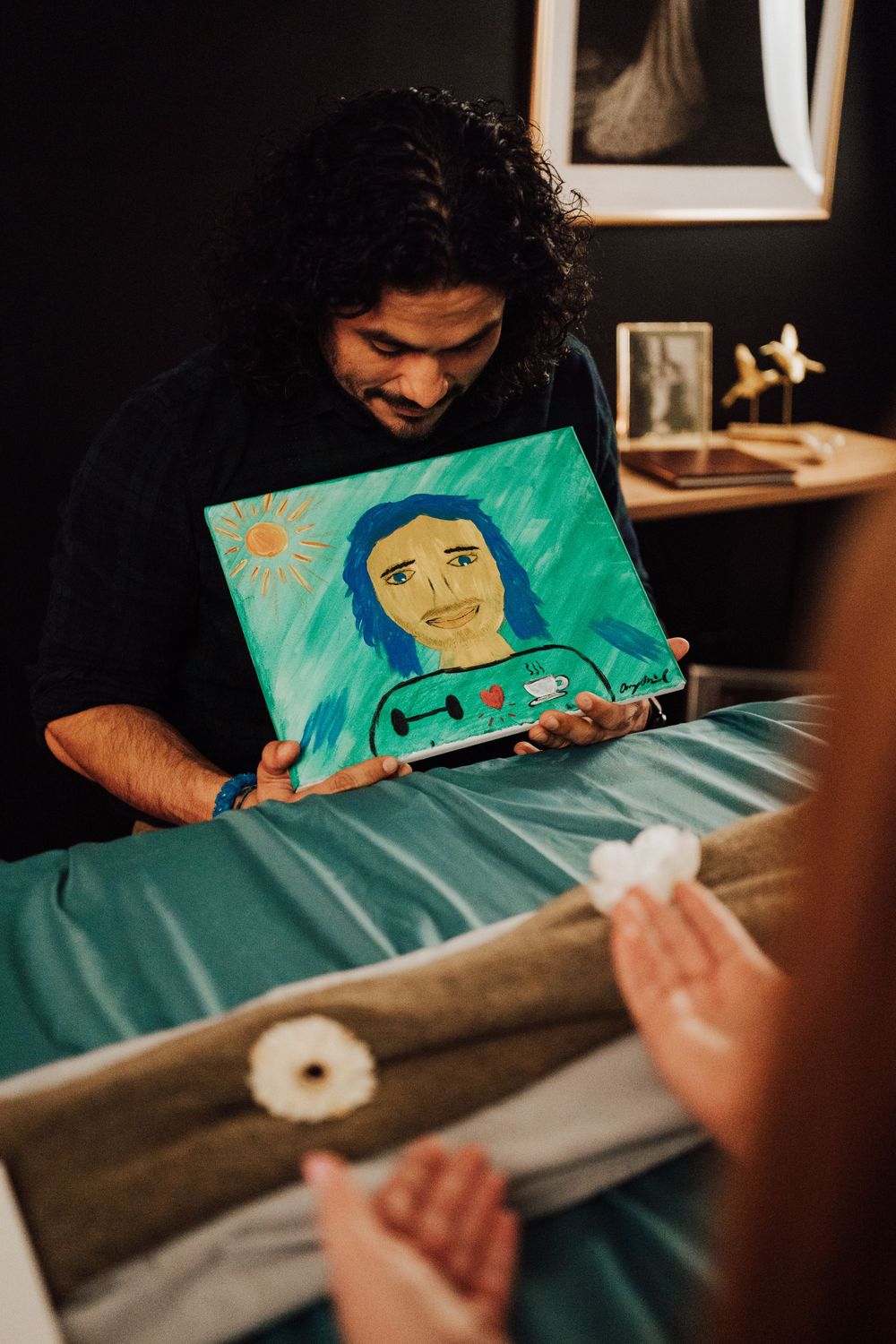 Engaged couple reveal their portrait paints at Sip & paint date night at Nicolle Aponte Photography Studio in Middletown, PA