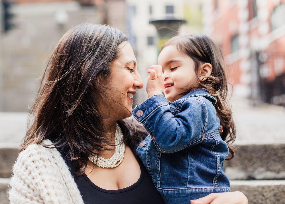 People sharing joyful moments and laughter together in a candid photo series.