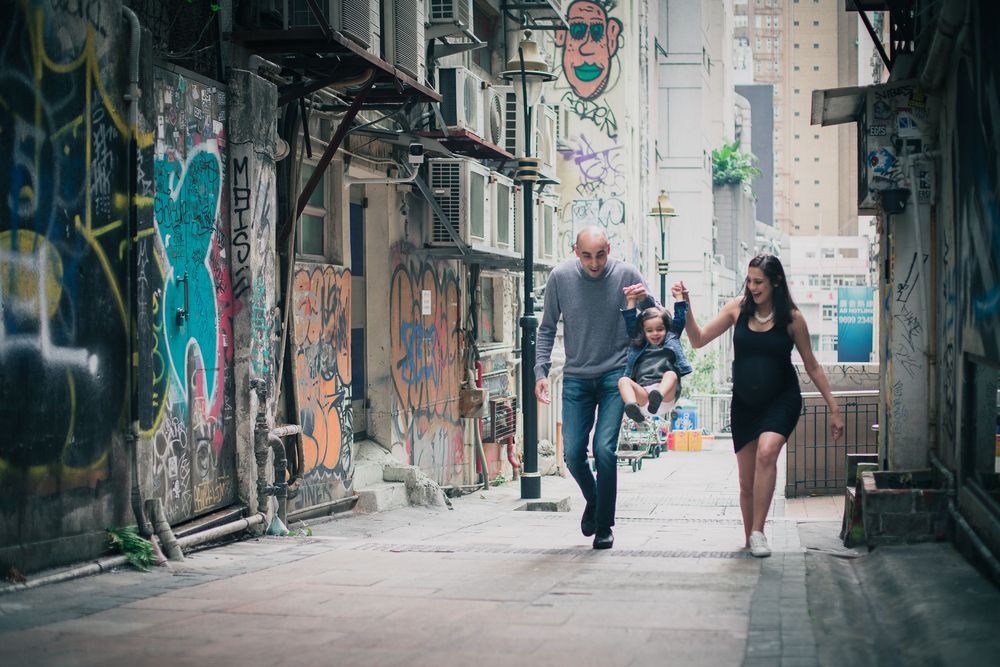 Urban street scene with colorful graffiti walls and people walking together in Melbourne's Hosier Lane.