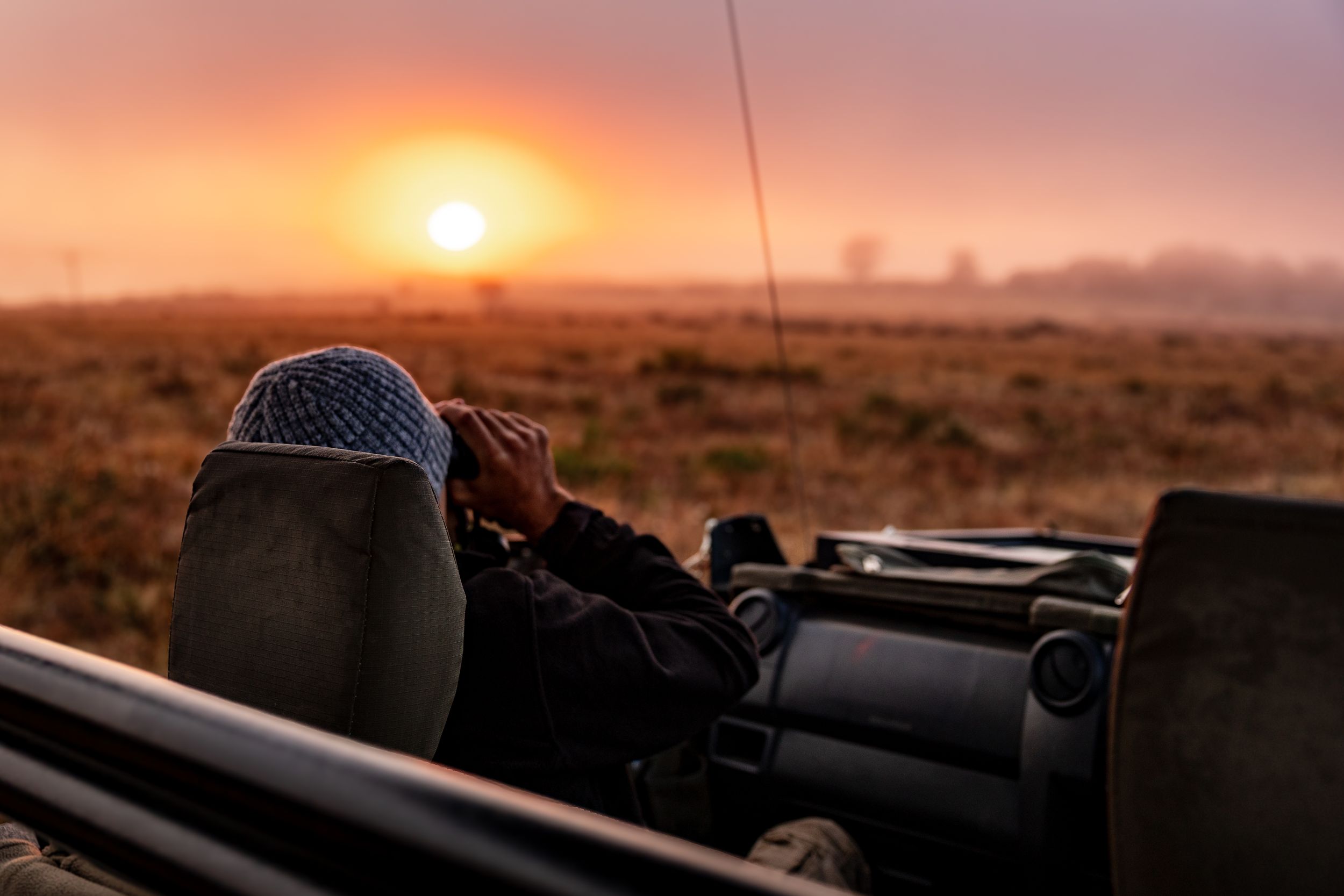 Golden Hour light on a game drive watching the African Sunset at a Luxury Safari Lodge in South Africa.