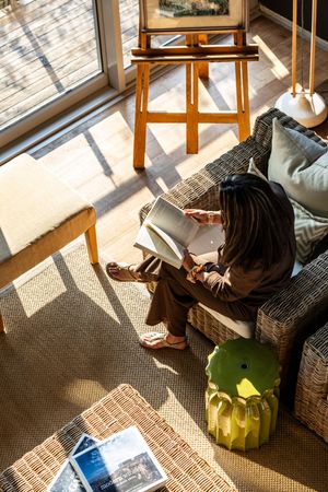 Experiencing the natural light streaming through the glass walls of a unique stay in South Africa.