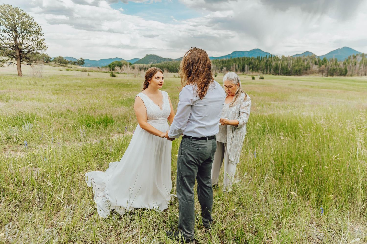 couple dancing at sunset in Upper Beaver Meadows, wildflower field and soft golden light, quiet RMNP elopement