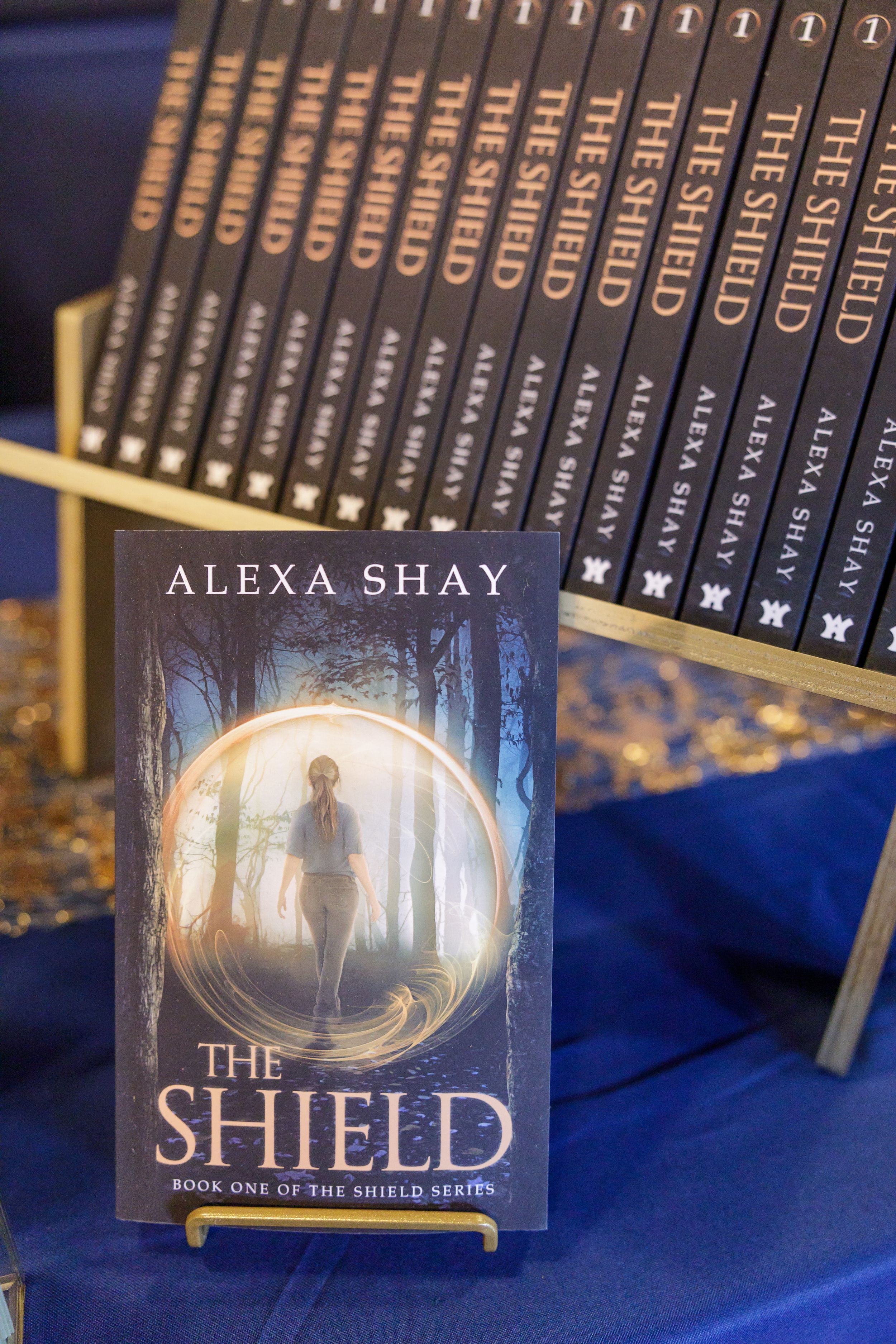 indie book author Alexa Shay author signing event in Seattle, WA bookstore table display of stack of books ready to sign for readers