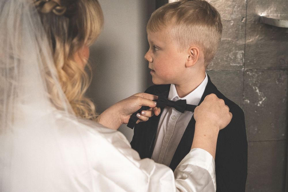 A series of romantic black and white wedding photos showing intimate moments between bride and groom.