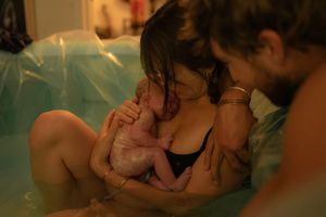 Home Birth photography, mother holding baby,  
Northern Colorado birth photographer, home birth photographer, free birth photographer