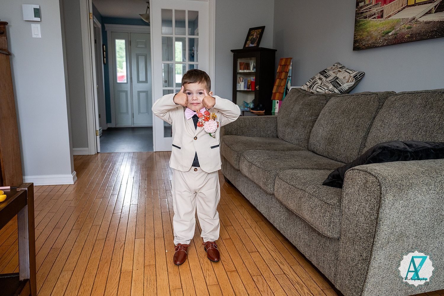A series of interior home shots featuring a gray couch and hardwood floors in an empty living space.