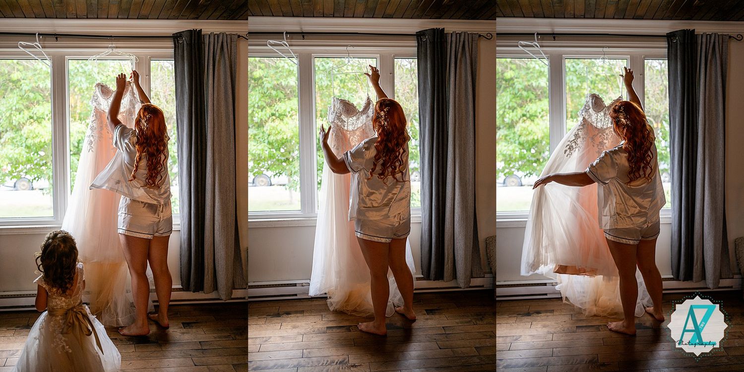 Wedding dress preparations in bright interior room with large windows and hardwood floors.