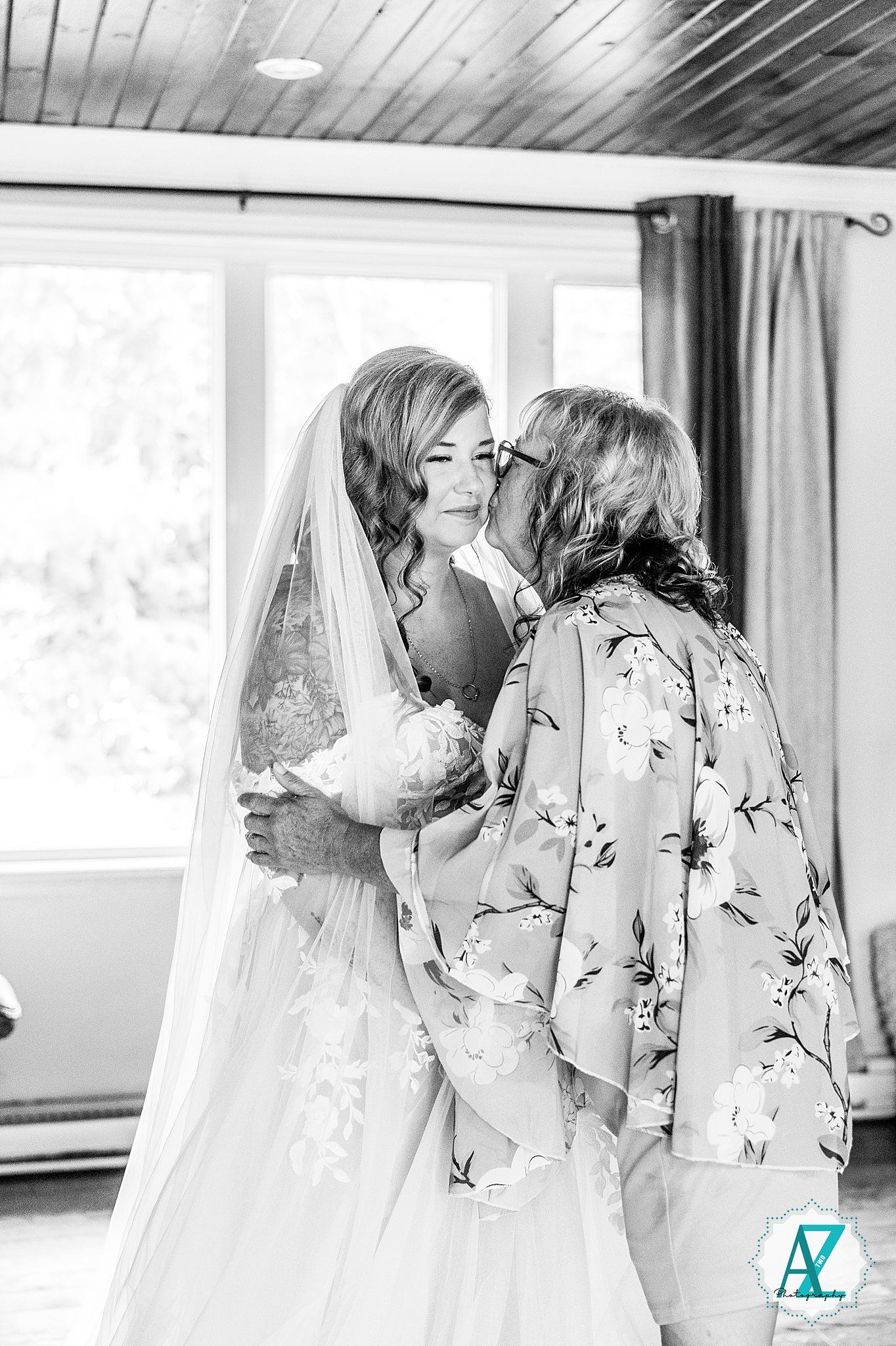 Black and white artistic photo series showing a bride in her wedding dress with someone in a floral print outfit.