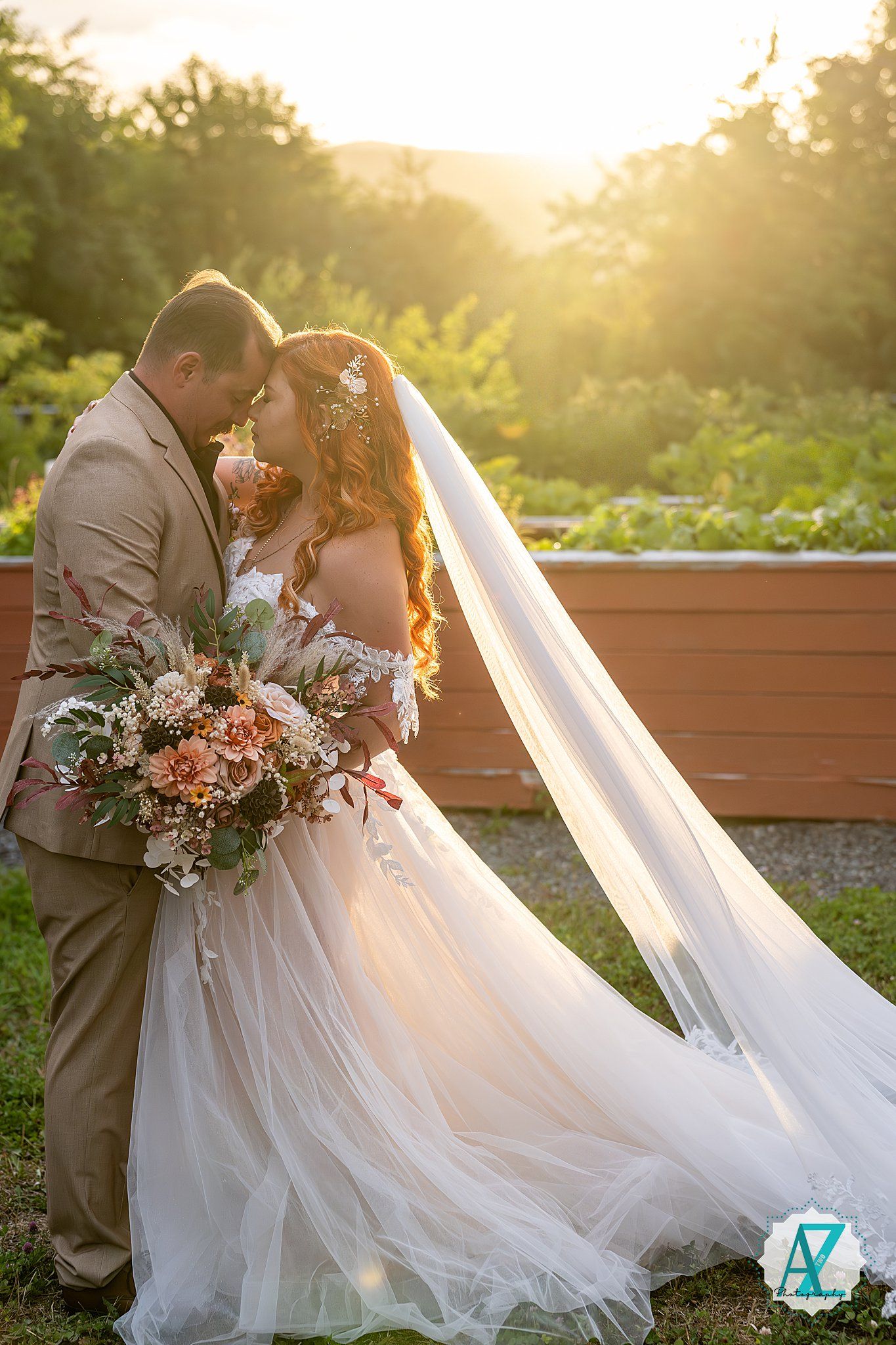 A romantic wedding photoshoot at sunset showcasing flowing white dress details and floral arrangements.