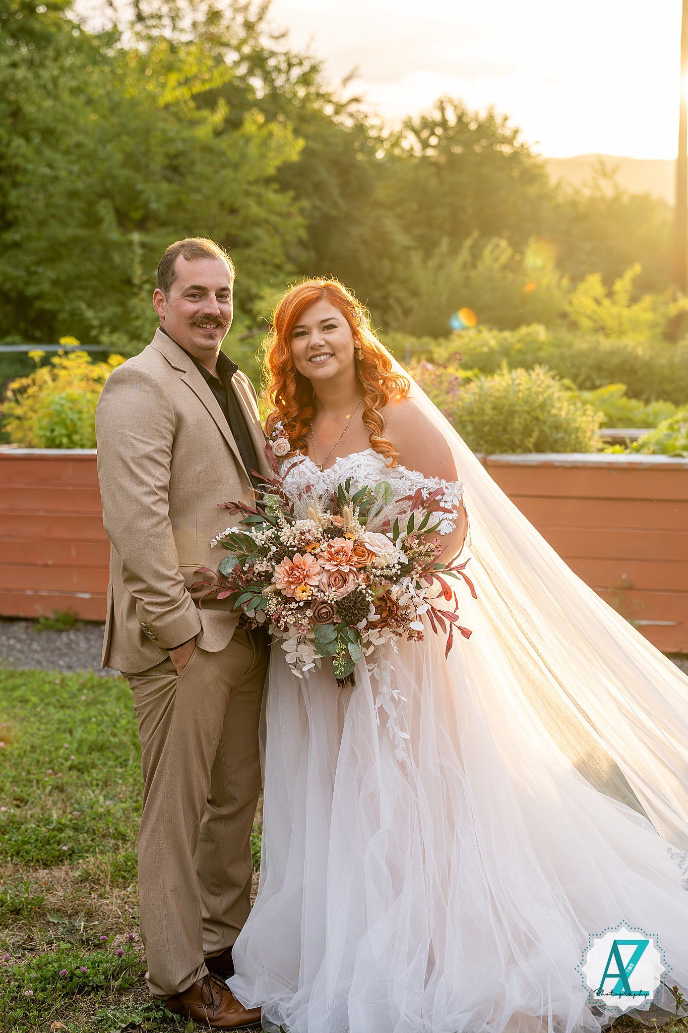 Sunlit wedding portraits on outdoor deck with flowing white dress and peach florals.