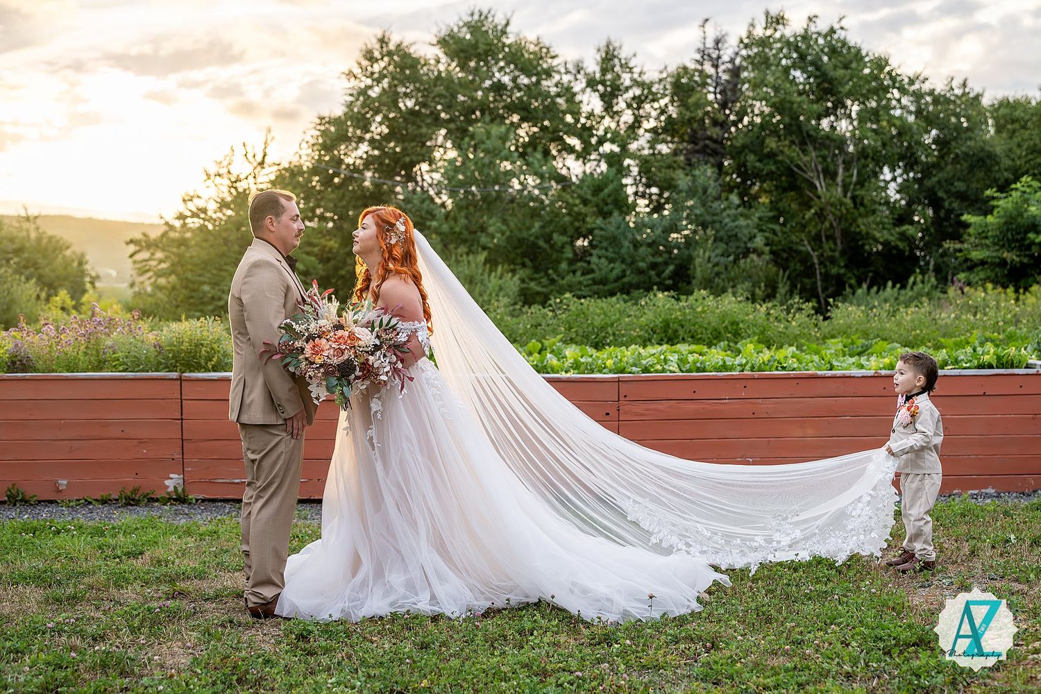 Elegant wedding couple poses in a lush garden setting with soft golden sunlight filtering through the trees.