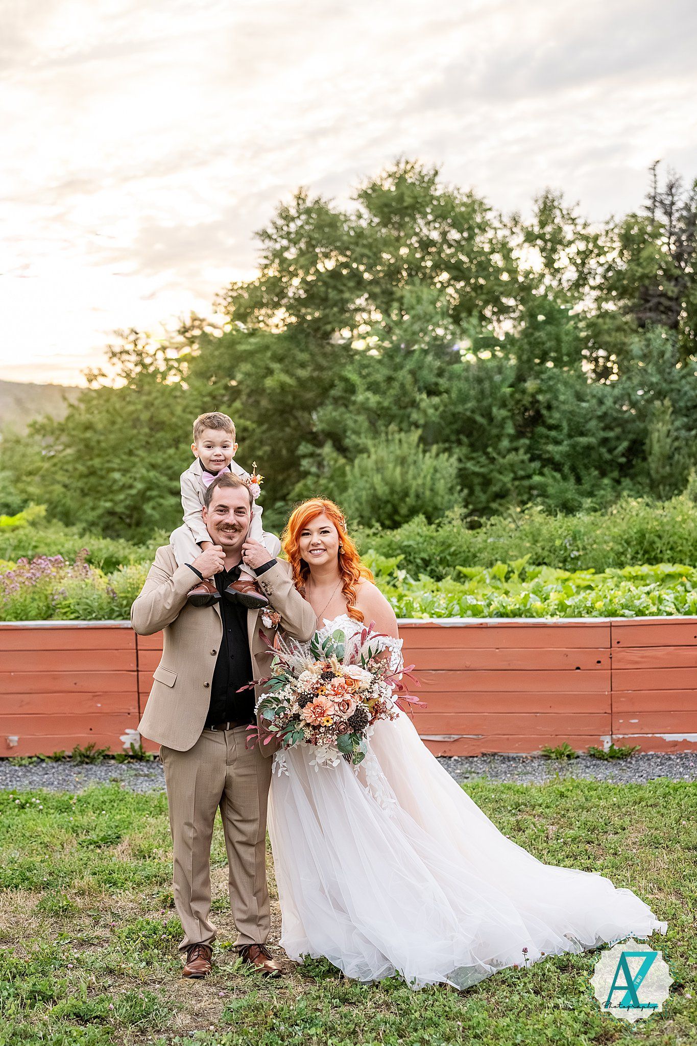 Outdoor wedding celebration with formal attire against natural green backdrop.