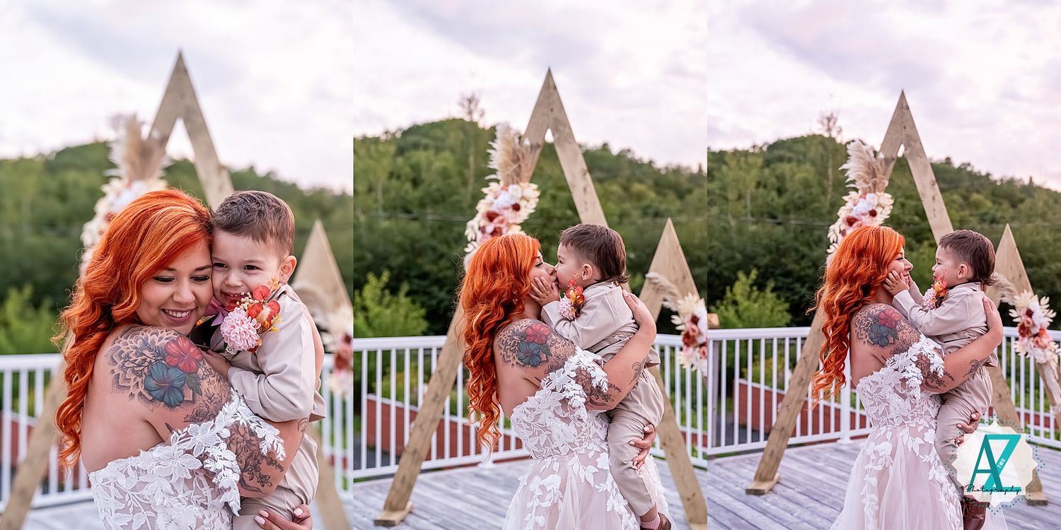 Couple sharing a romantic embrace and kiss in a scenic garden on their wedding day.