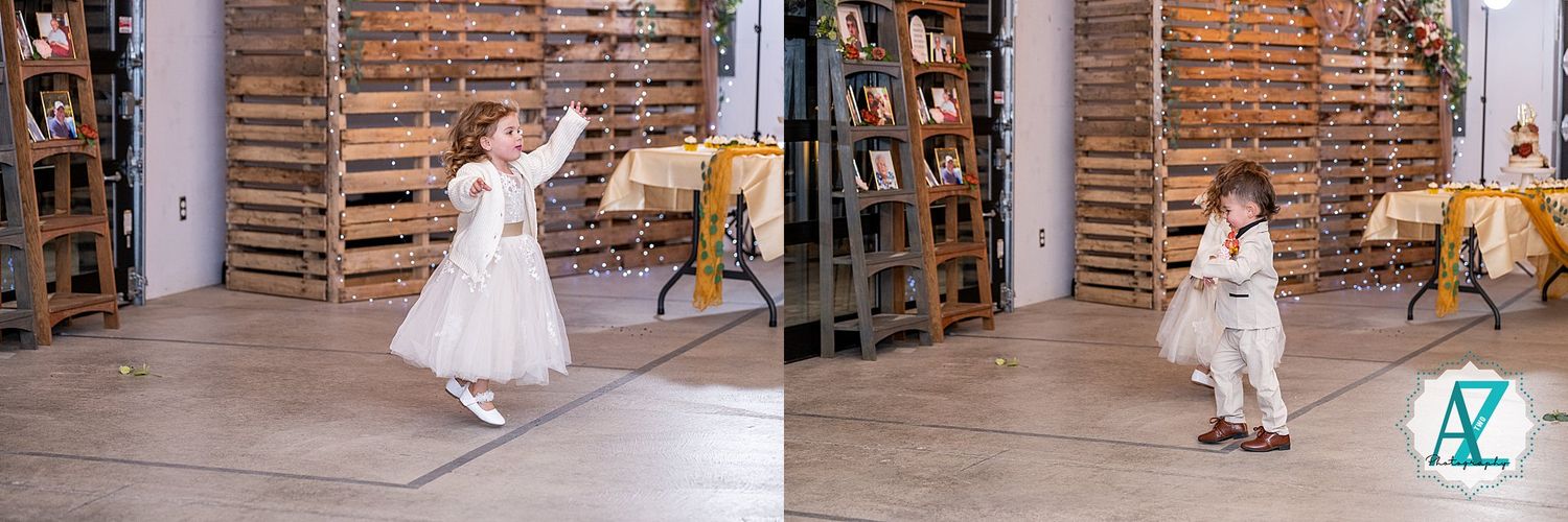Guests dancing and celebrating in an indoor venue with exposed brick walls.