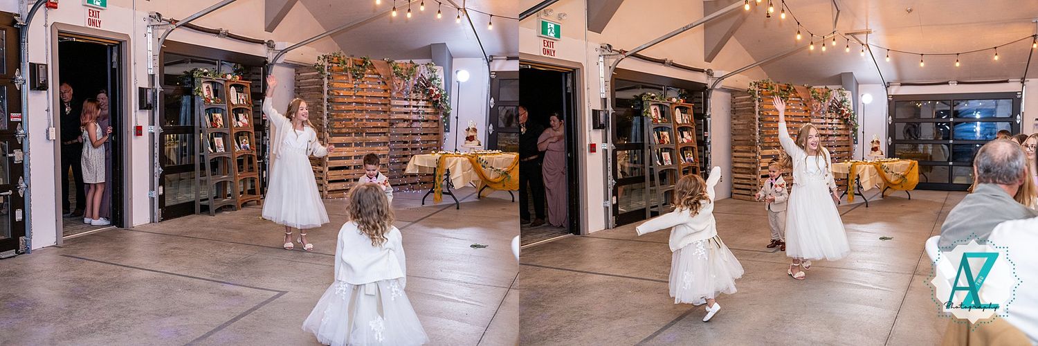 Panoramic view of a wedding reception venue with string lights and white decor elements.