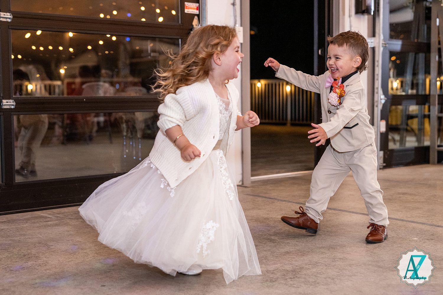 Candid dance floor moments captured during a wedding reception with guests moving and celebrating.