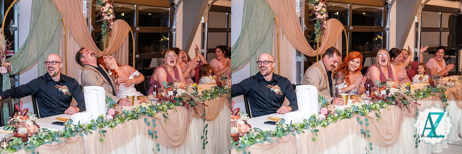 Group of wedding guests watching a slow dance during an evening reception with decorative lighting.