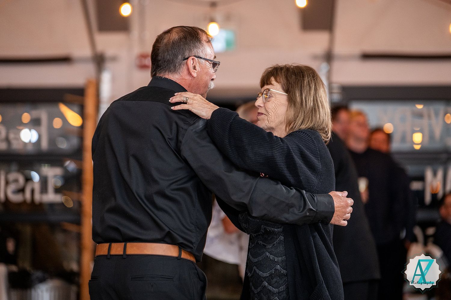 A series of photos showing couples dancing and twirling together on a ballroom dance floor.