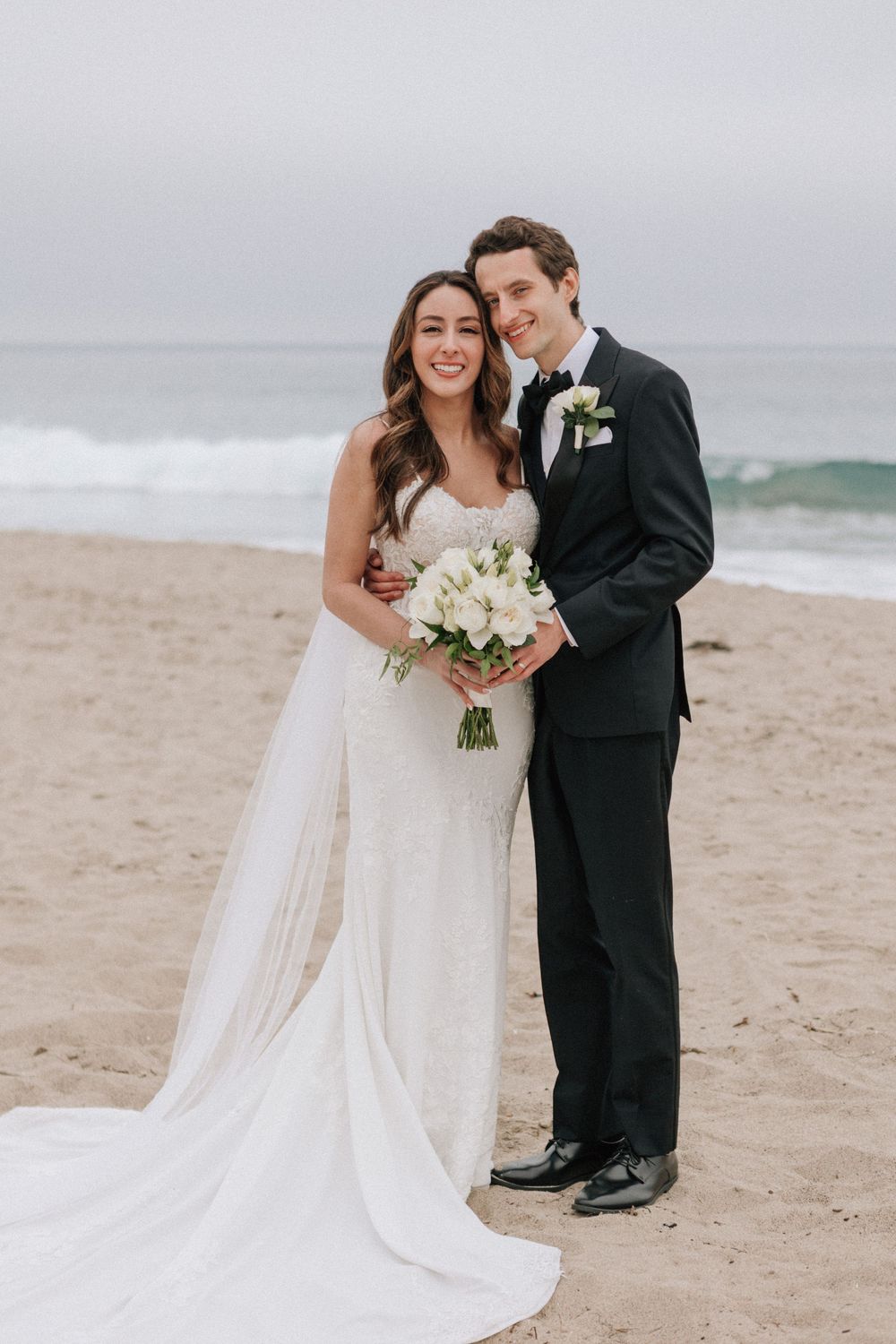 Malibu beach wedding portraits on 35mm film featuring the waves and sand.