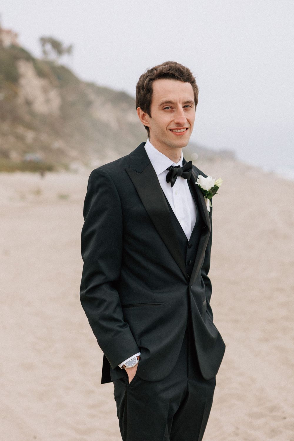 Malibu film photographer portrait of the groom at Point Dume State Beach.
