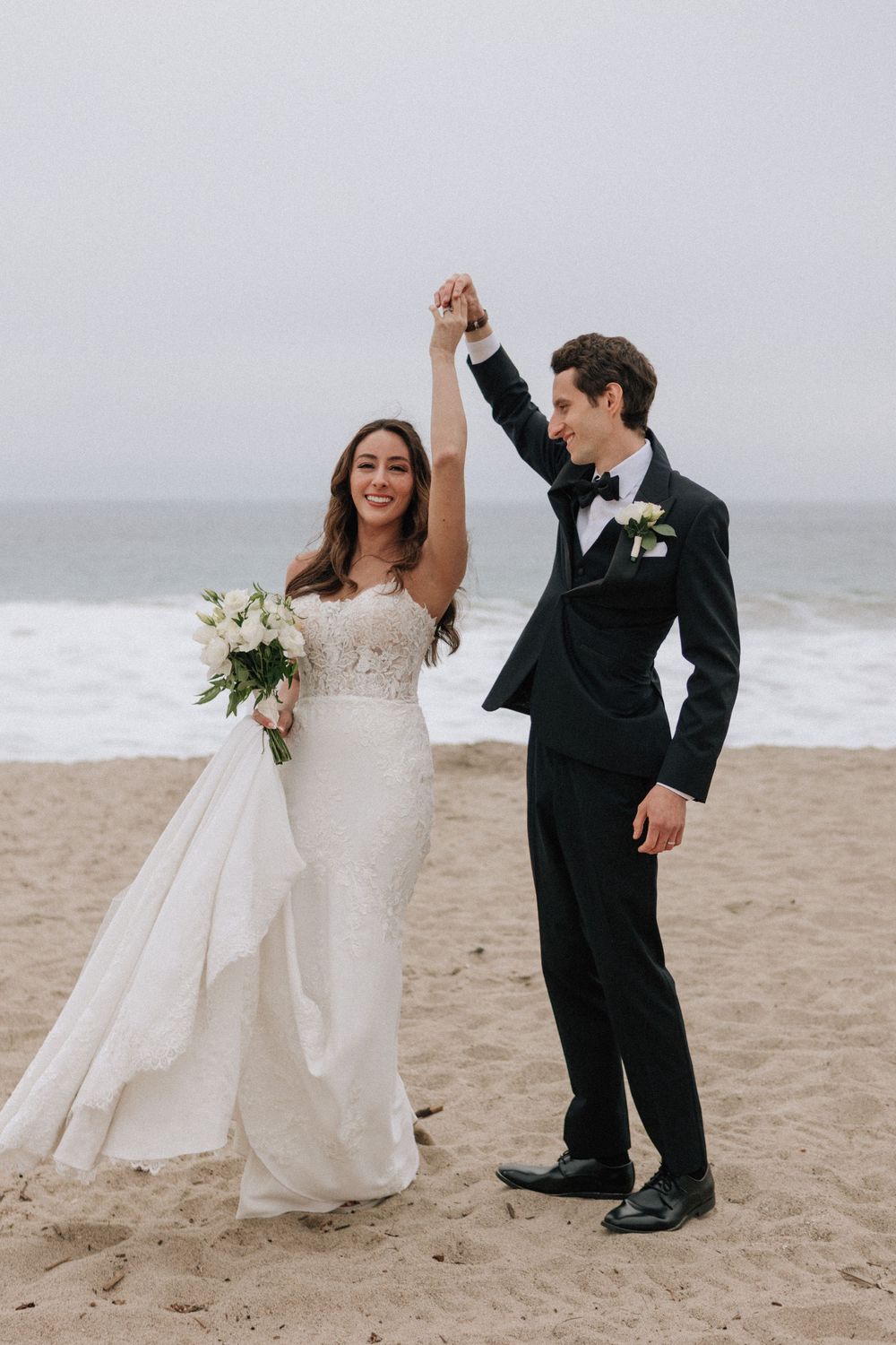 Malibu wedding photographer capturing the groom twirling the bride at The Sunset Restaurant.