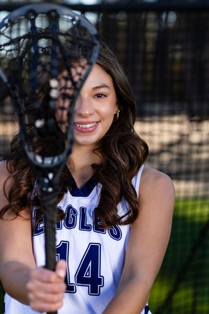 Athletic portrait series featuring a white and navy Eagles jersey number 14.