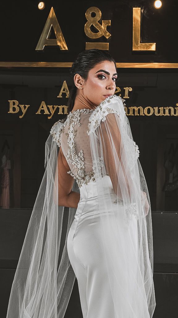 Bridal fashion series featuring white gown with delicate lace veil details.