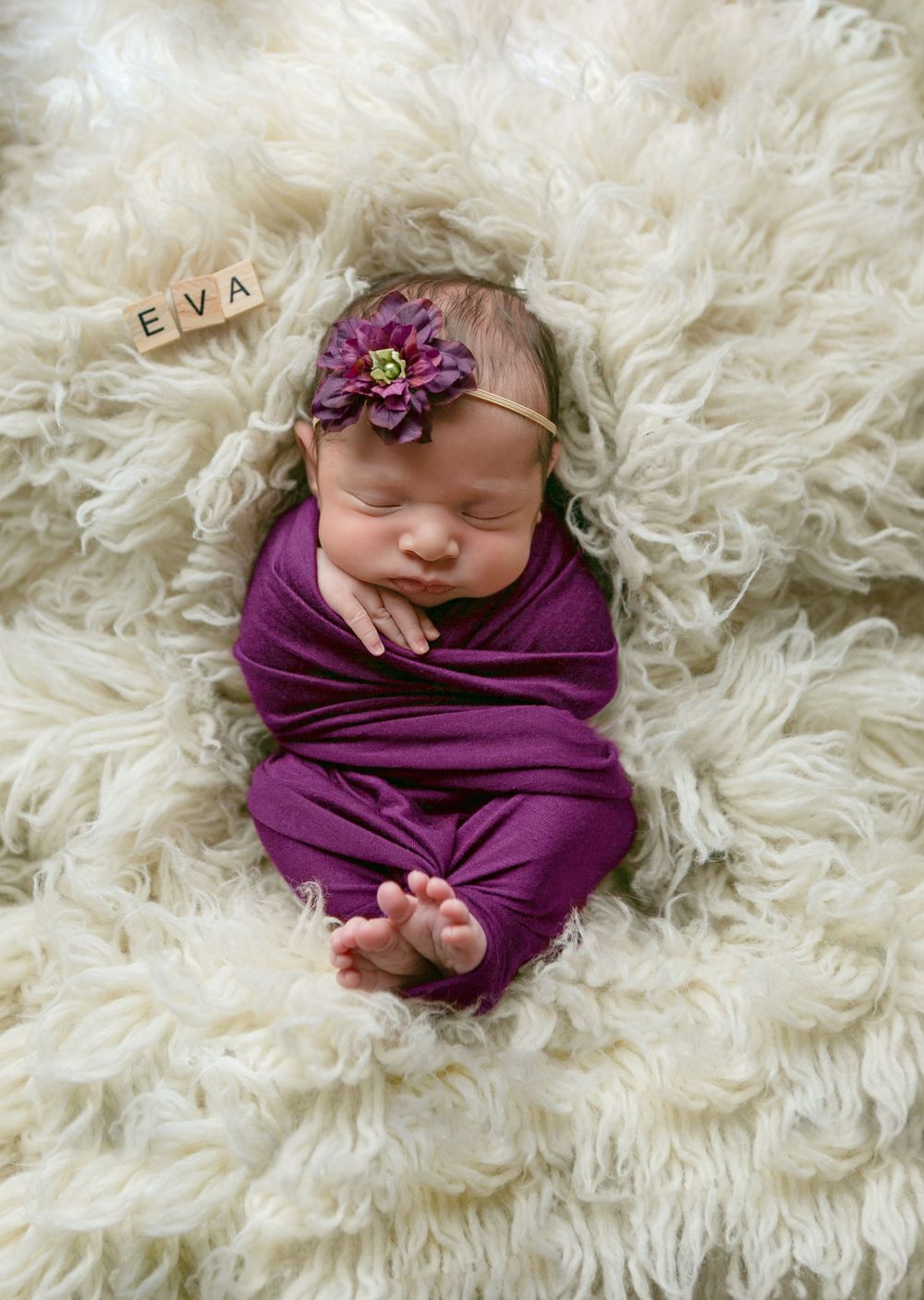 Newborn baby wrapped in purple swaddle, Orlando Newborn Photography, Sanford Newborn Photography