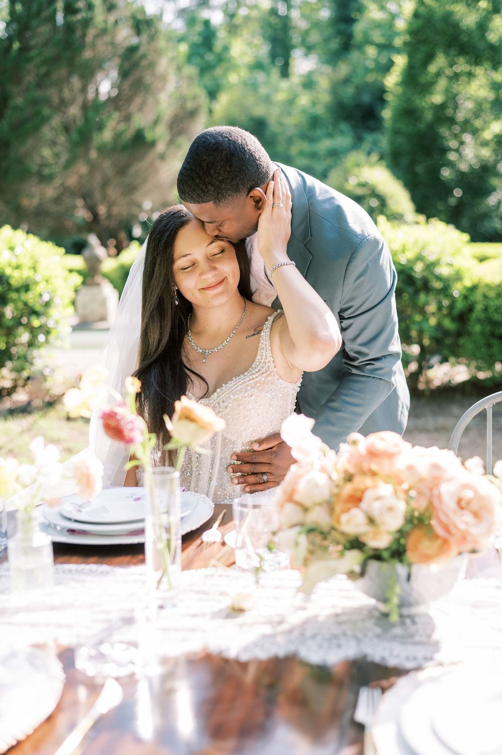 Romantic tablescape set for an elegant outdoor wedding reception at a wedding venue in Fayetteville NC called Villa Mirabela