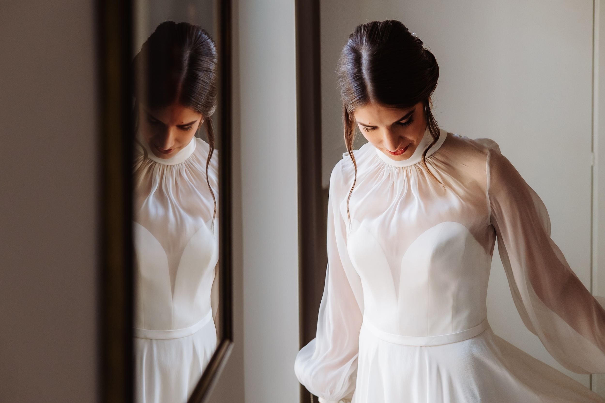 A woman in a flowy white dress walks through a sunlit hallway, creating a dreamy mood with soft natural light.